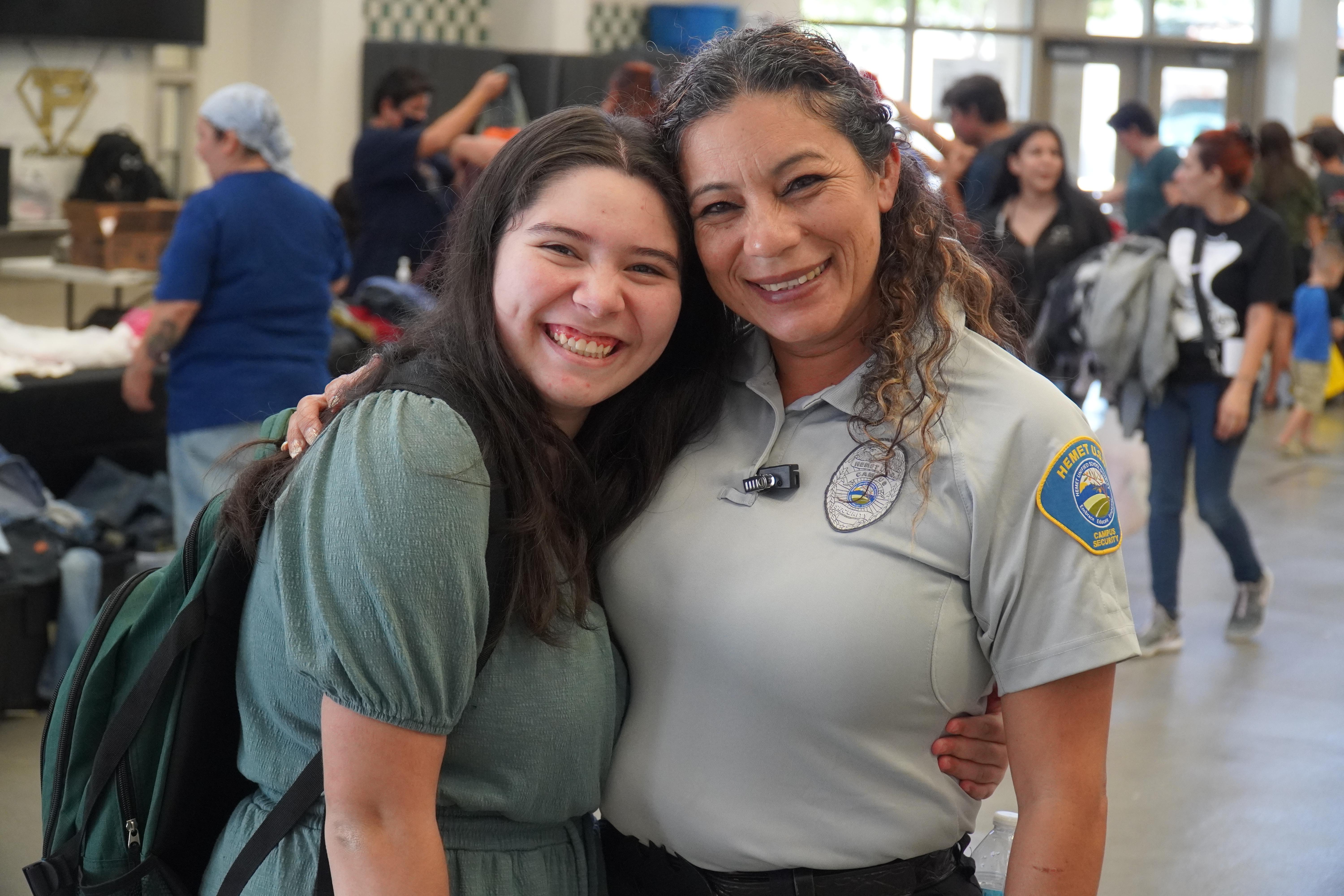 female security guard and student smiling